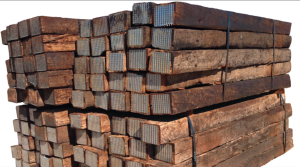 Four bundles of 8' treated lumber used railroad ties stacked together