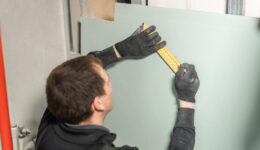 A Man Clearly Demonstrates How to Do Drywall