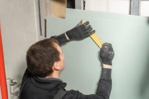 A Man Clearly Demonstrates How to Do Drywall