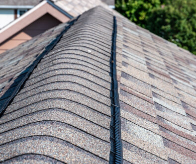 Closeup of A House Roof with Architectural vs. Three-Tab Shingles